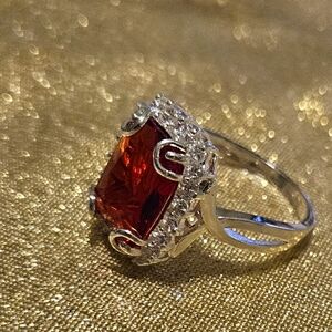 Silver tone ring w red bling